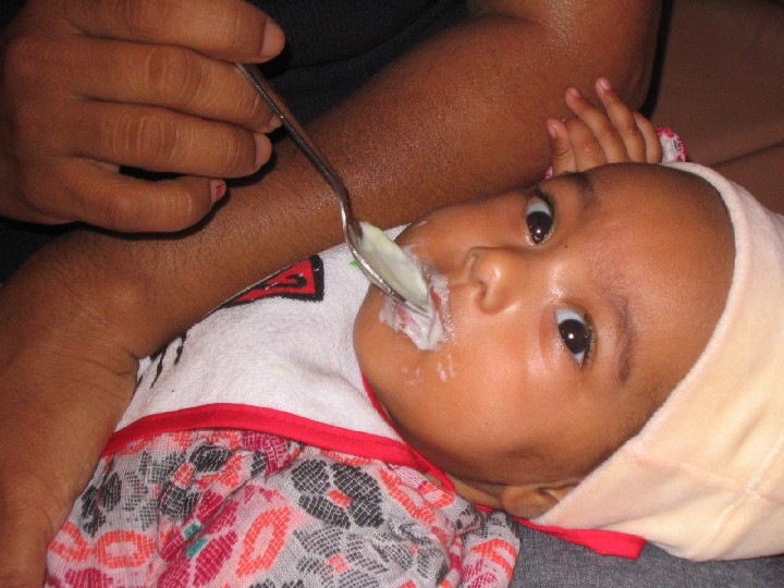 Anna first time eating.jpg